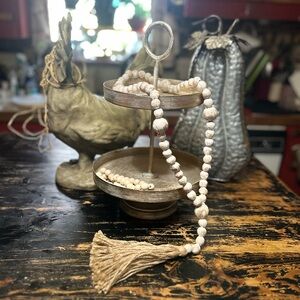 Bohemian Wooden Bead Garland with Tassel and gold tiered tray.